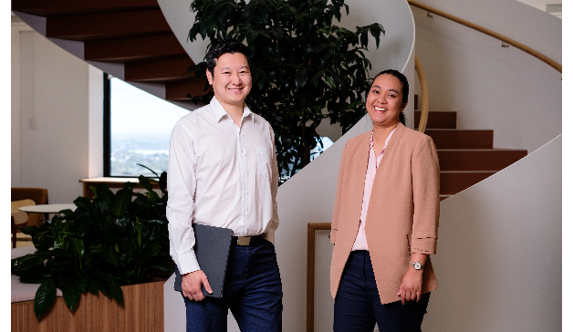 A male and female ATO employee smiling